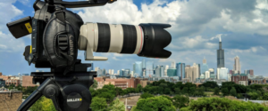 a large lens pointed over a cityscape